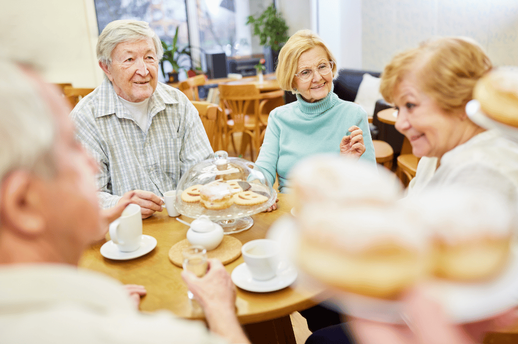 Seniors having meal time in an assisted living facility